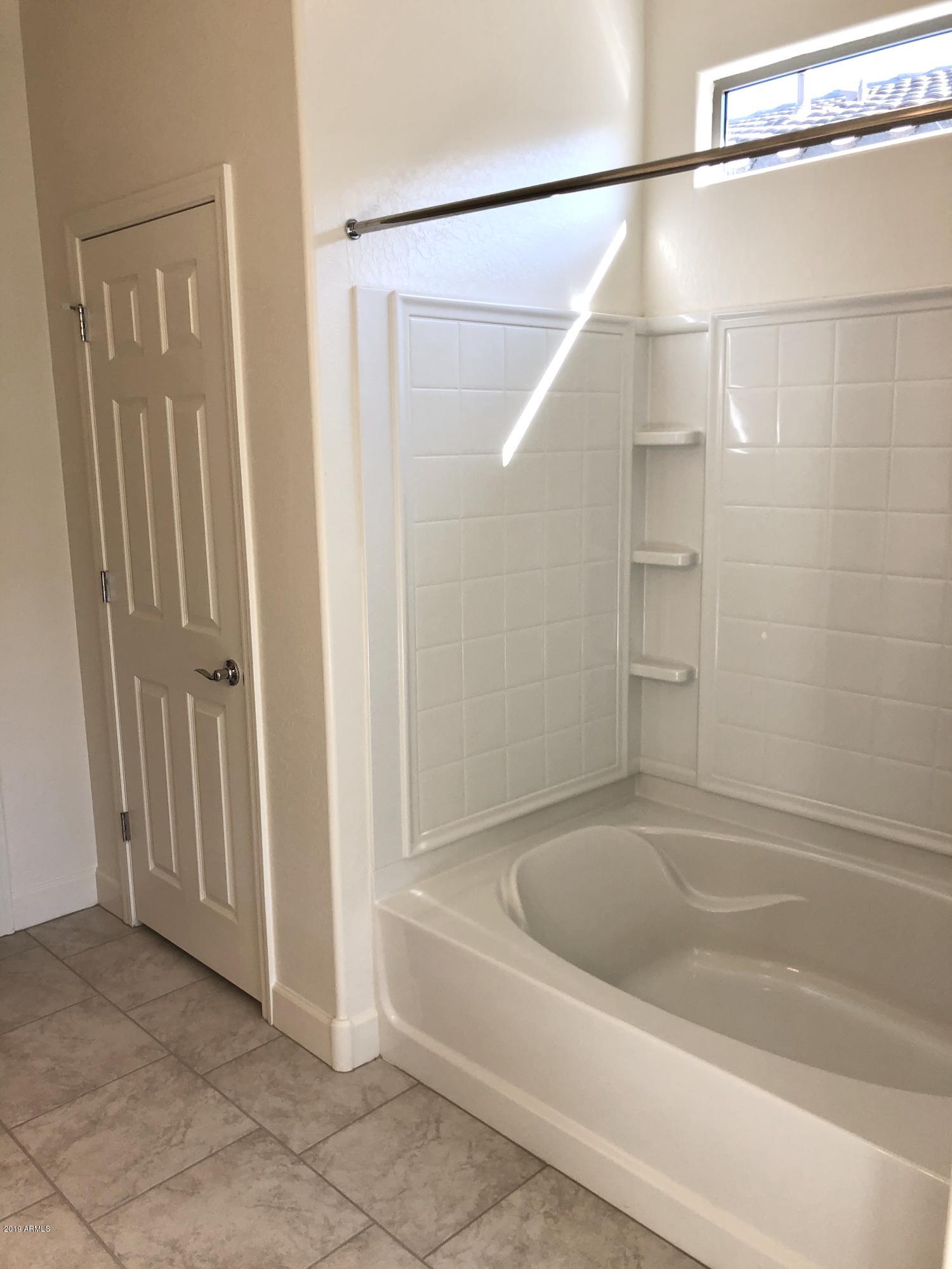 3217 West Fremont Rd. Phoenix, AZ 85041 - Photo 8 of 17 Master Shower and Tub with Linen