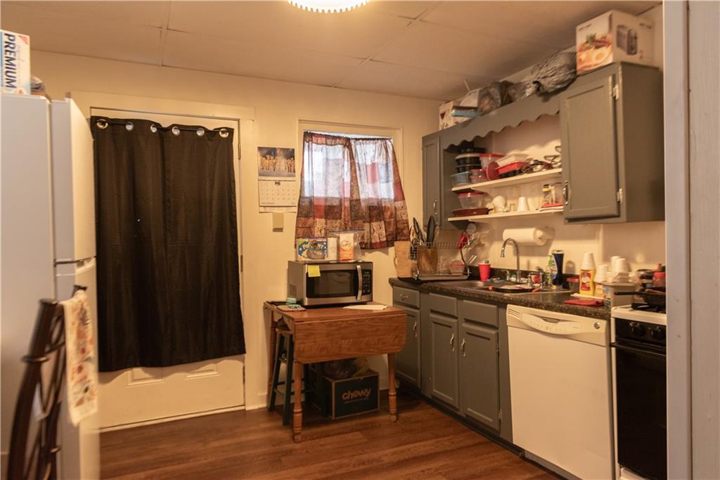 47-49 South S 5th Street Indiana, PA 15701 - Photo 6 of 14 a kitchen with a sink a stove and cabinets
