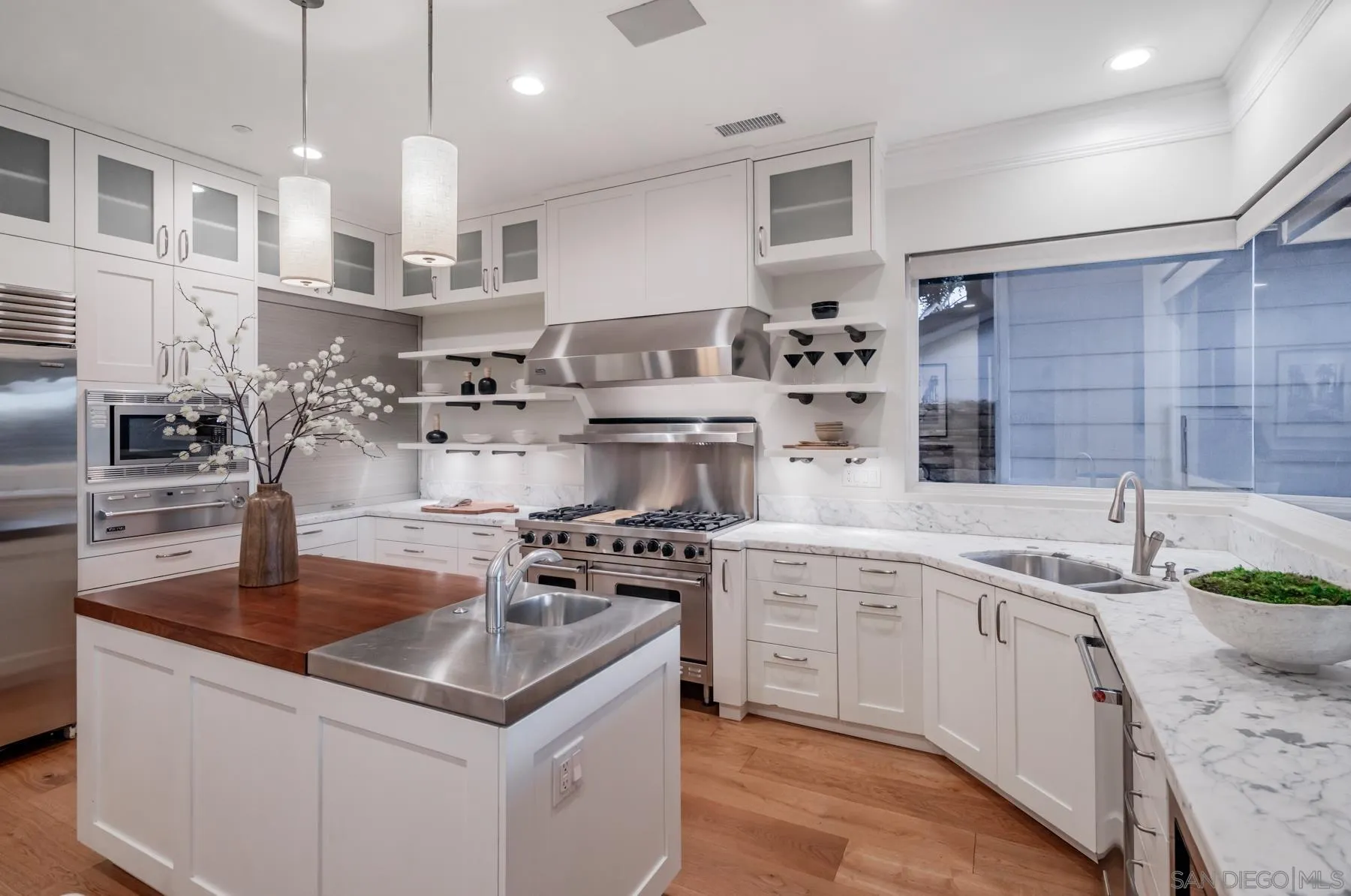 1650 Bella Laguna Court Encinitas, CA 92024 - Photo 12 of 41 a kitchen with stainless steel appliances granite countertop a sink a stove and a refrigerator