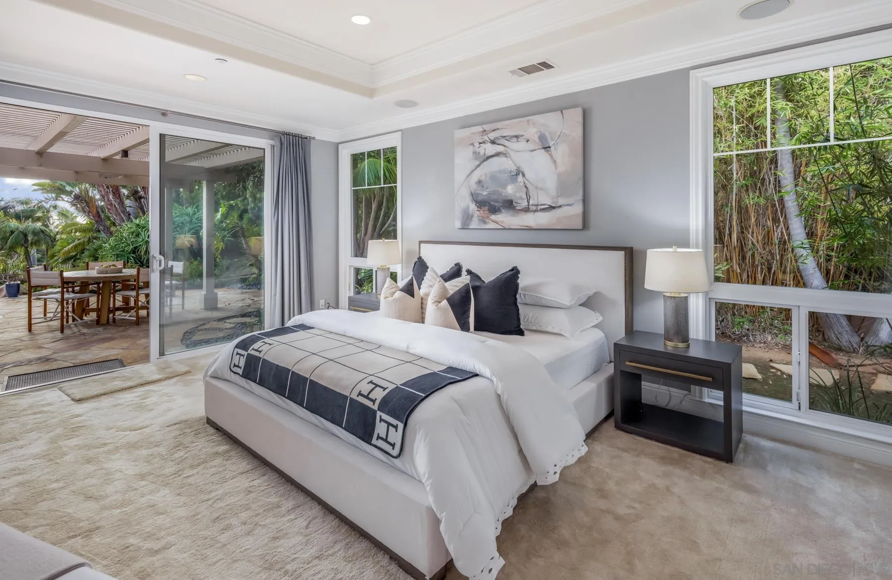 1650 Bella Laguna Court Encinitas, CA 92024 - Photo 18 of 41 a spacious bedroom with a large bed and a large window