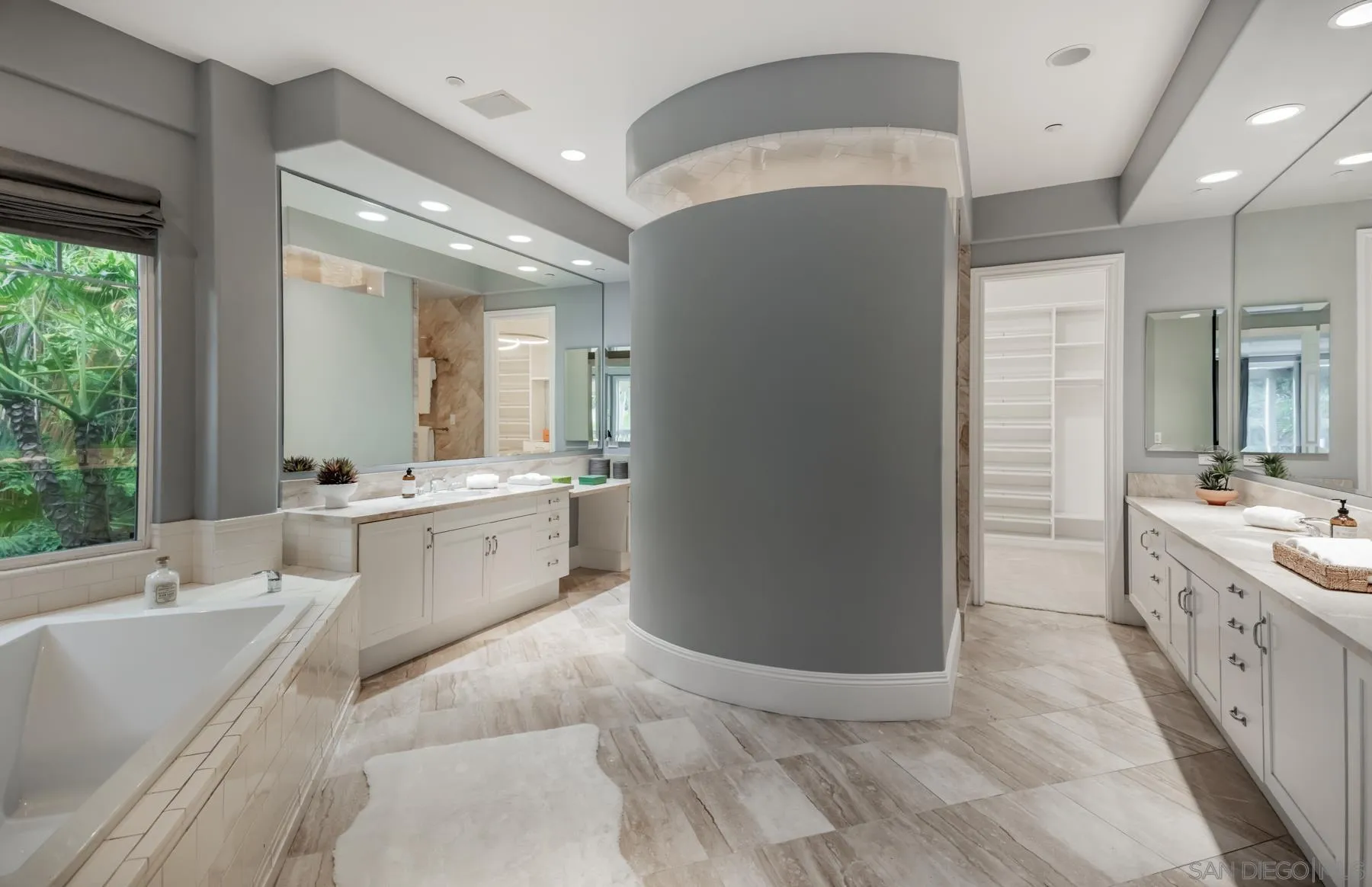 1650 Bella Laguna Court Encinitas, CA 92024 - Photo 19 of 41 a large bathroom with a double vanity sink a mirror and a bathtub