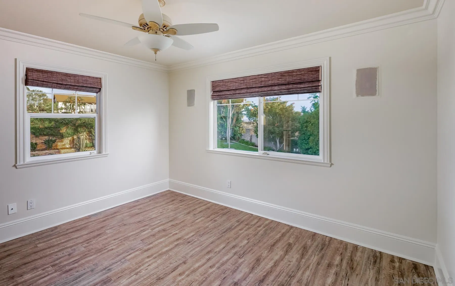 1650 Bella Laguna Court Encinitas, CA 92024 - Photo 22 of 41 a view of an empty room with wooden floor and a window