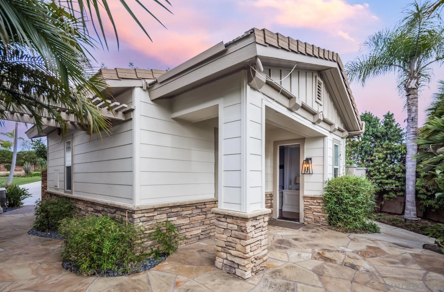 1650 Bella Laguna Court Encinitas, CA 92024 - Photo 26 of 41 a front view of a house with a garden