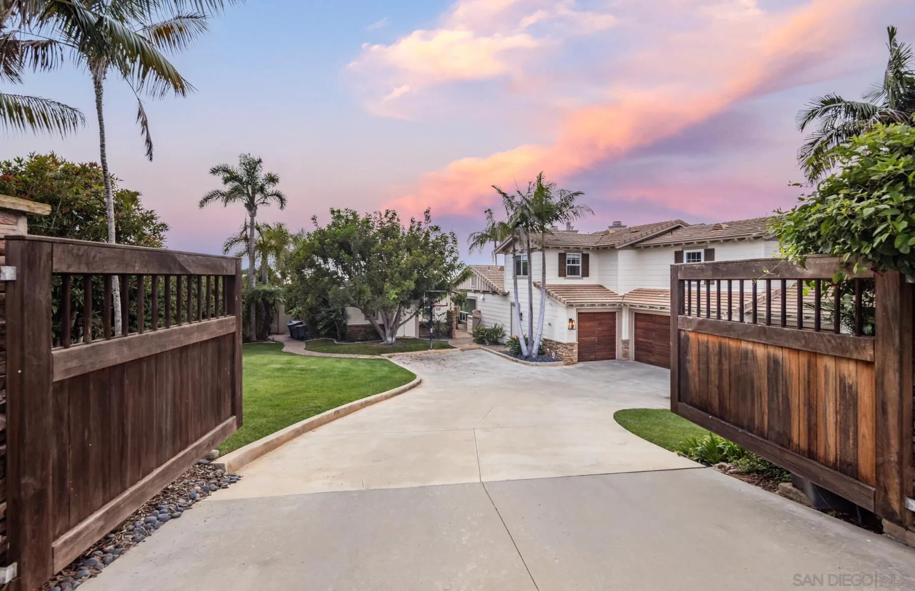 1650 Bella Laguna Court Encinitas, CA 92024 - Photo 39 of 41 a view of a house with a yard and potted plants