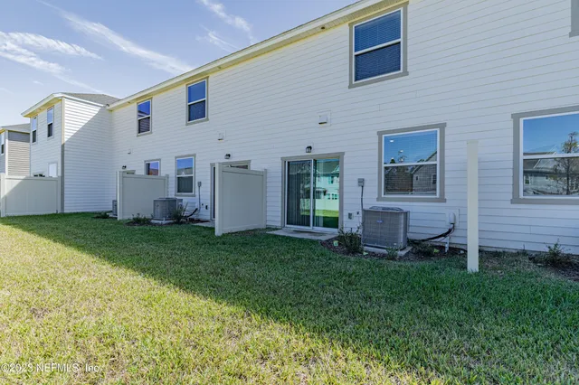 a view of backyard with seating area