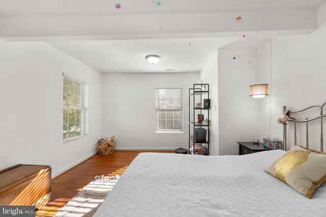 a bedroom with bed and window