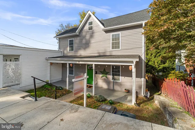 a front view of a house with a porch