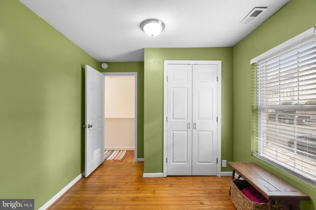 a view of room with window and hardwood