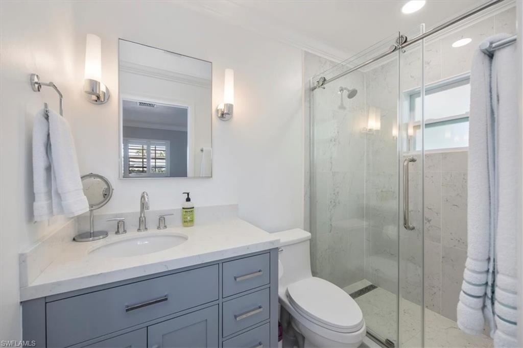 1236 13th Avenue North Naples, FL 34102 - Photo 15 of 25 Primary en-suite bathroom.
