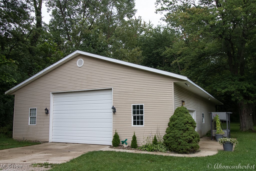 1667 Red Bird Road Madison, OH 44057 - Photo 12 of 44 A GEM to be seen! A workshop for mechanics, landscapers, Cross Fit gym. Has a full bath, heat, water, washer and dryer hook ups, insulated, automotive compressor with overhead equipment.