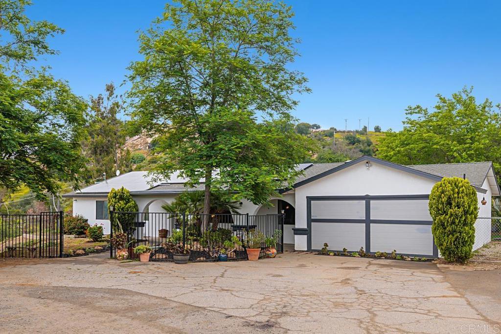 12650 Cumbres Road Valley Center, CA 92082 - Photo 1 of 1 a view of a house with a patio