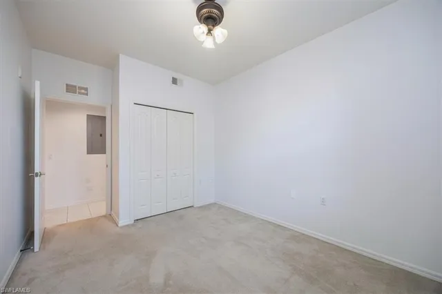 an empty room with a empty space and a window