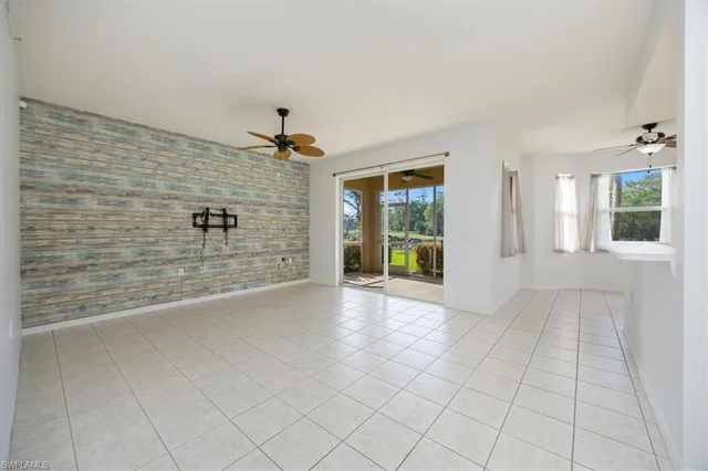 a view of an empty room with windows