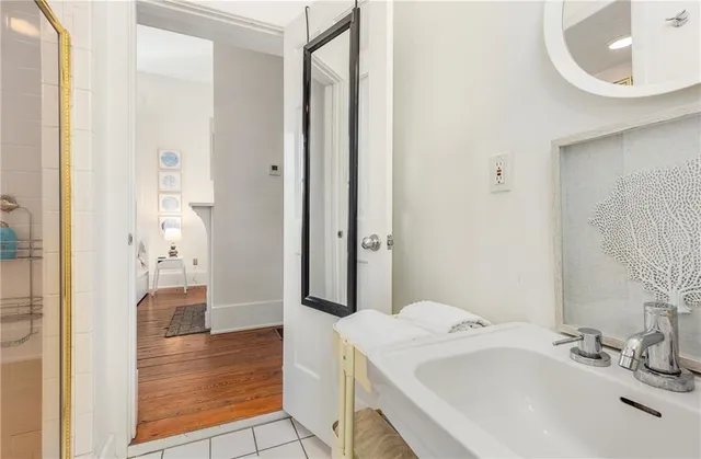 a bathroom with a sink and a mirror