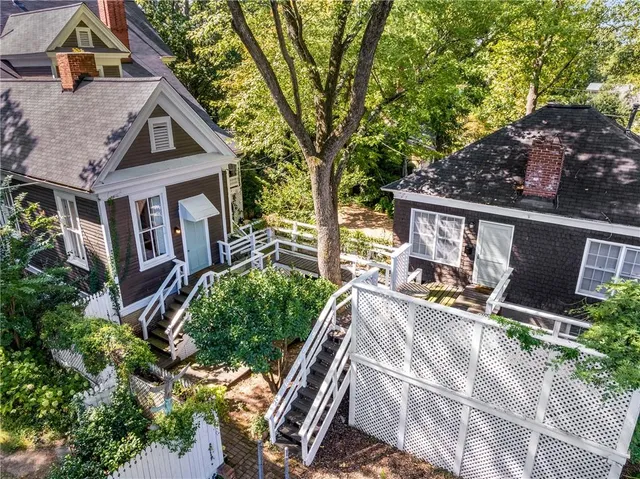 a view of house with outdoor space and sitting area
