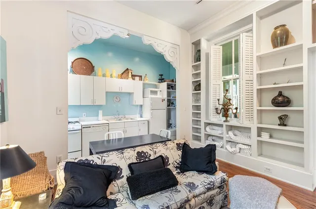 a living room with furniture and a floor to ceiling window