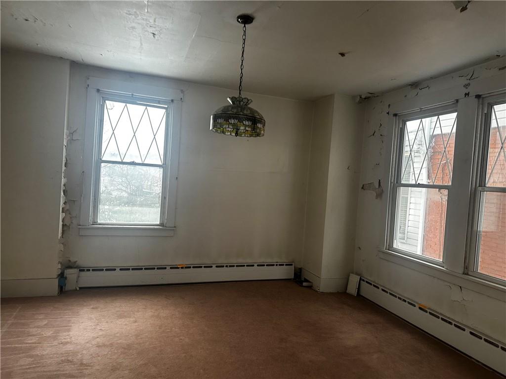 325 Elm Road Ambridge, PA 15003 - Photo 5 of 13 an empty room with a windows