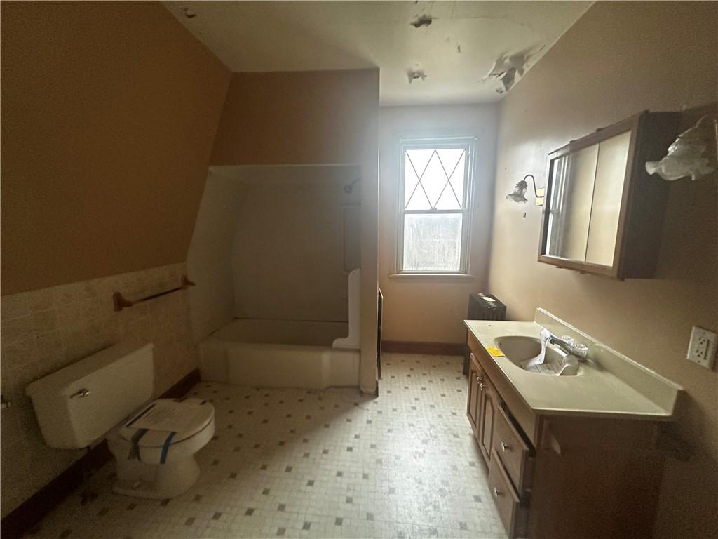 325 Elm Road Ambridge, PA 15003 - Photo 7 of 13 a bathroom with a sink toilet and shower