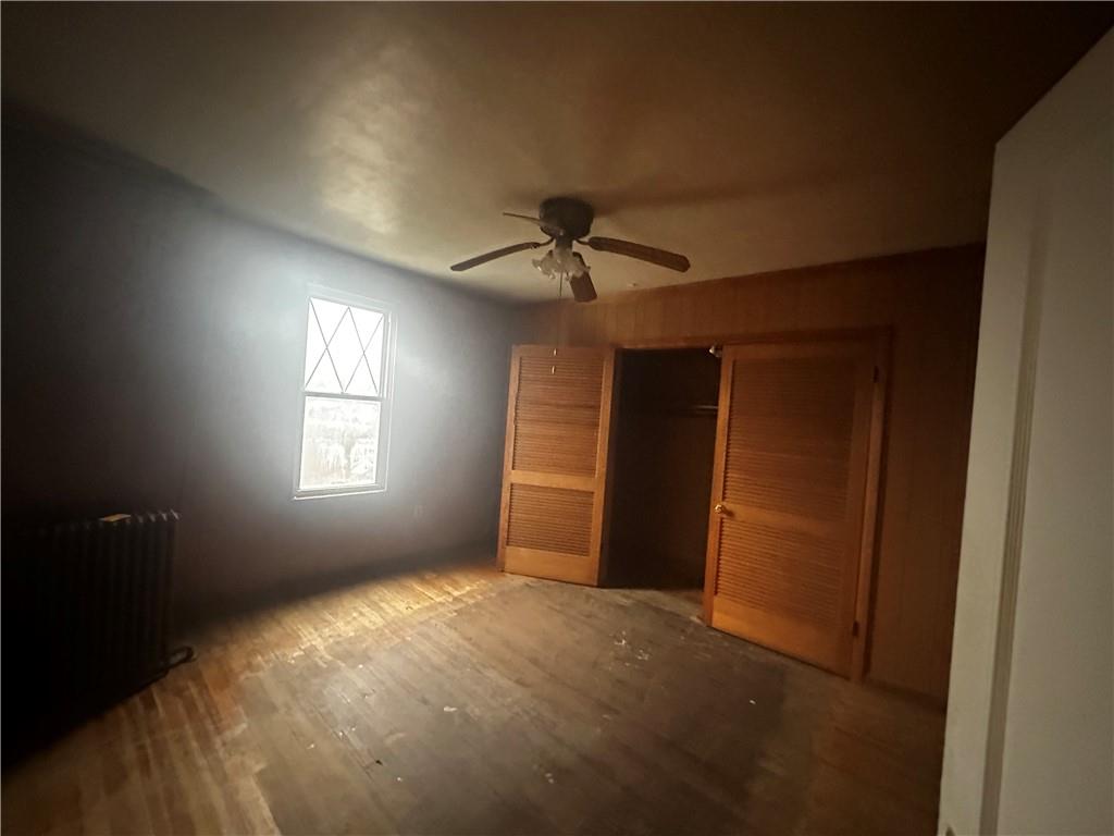 325 Elm Road Ambridge, PA 15003 - Photo 8 of 13 an empty room with windows and fan