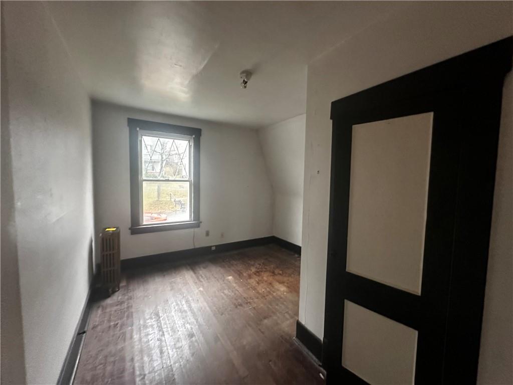 325 Elm Road Ambridge, PA 15003 - Photo 10 of 13 an empty room with wooden floor and windows