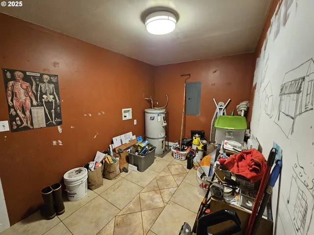a room with lots of white furniture and a wooden floor