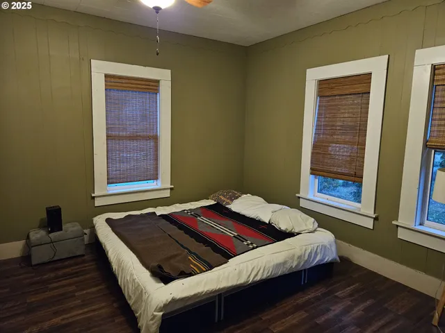 a bedroom with a bed and window