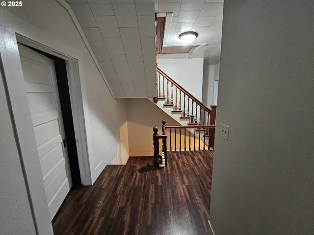 a view of entryway with wooden floor