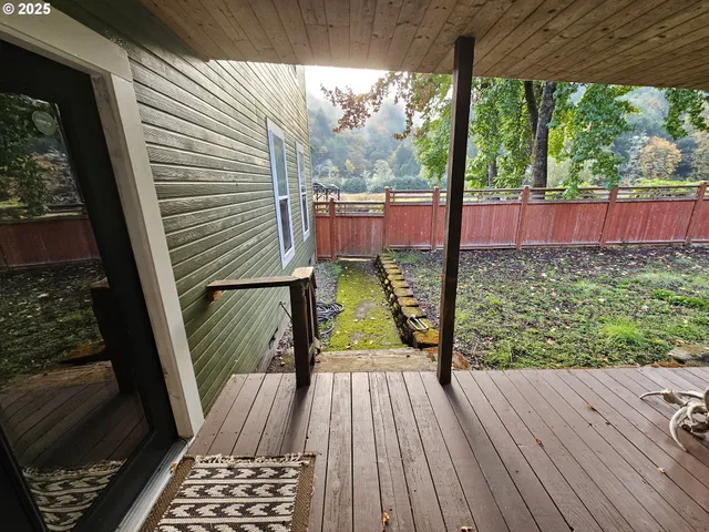 a view of balcony with wooden floor