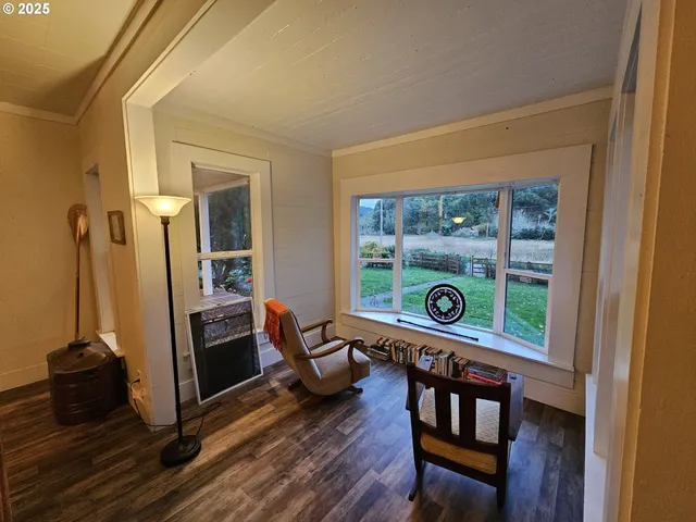 a reading room with furniture and a window