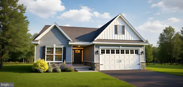a front view of a house with a garden and porch