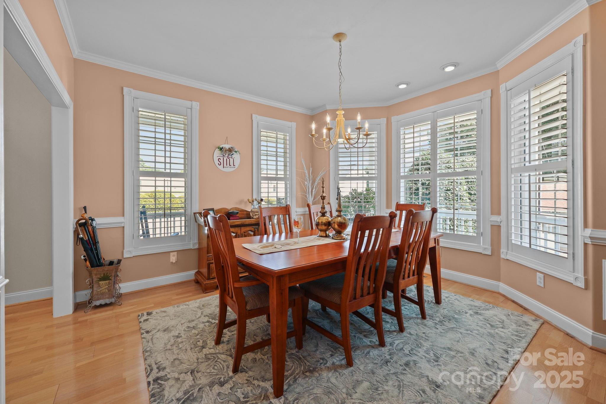 17200 Randalls Ferry Road Norwood, NC 28128 - Photo 13 of 48 a view of a dining room with furniture window and wooden floor