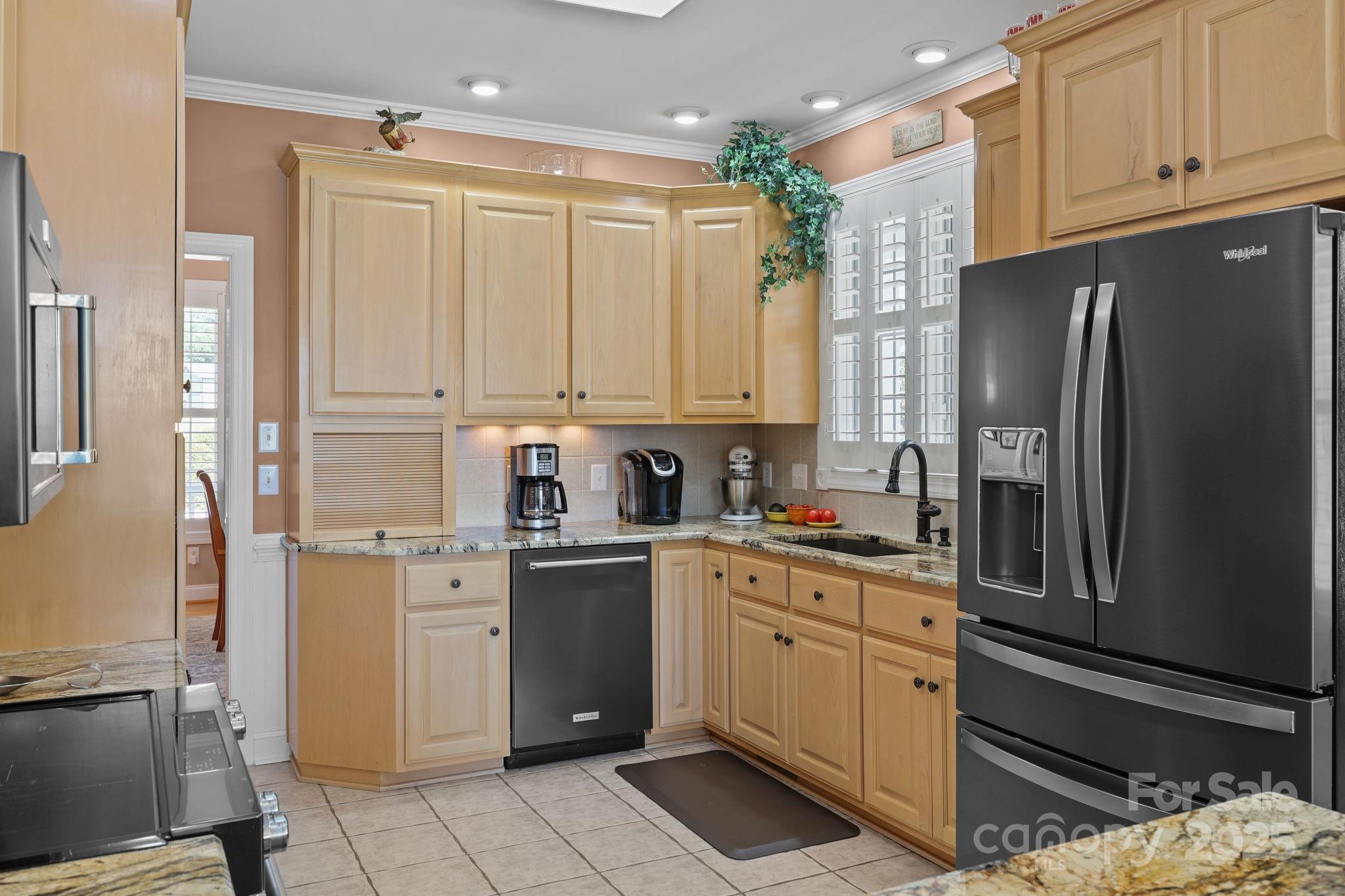 17200 Randalls Ferry Road Norwood, NC 28128 - Photo 14 of 48 a kitchen with stainless steel appliances granite countertop a refrigerator sink and cabinets