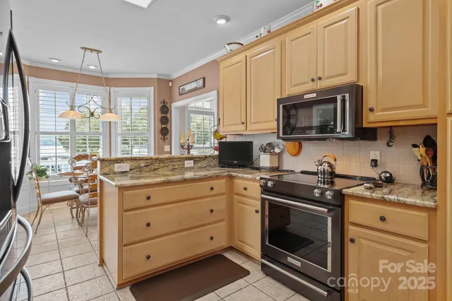 a kitchen with a refrigerator and a sink