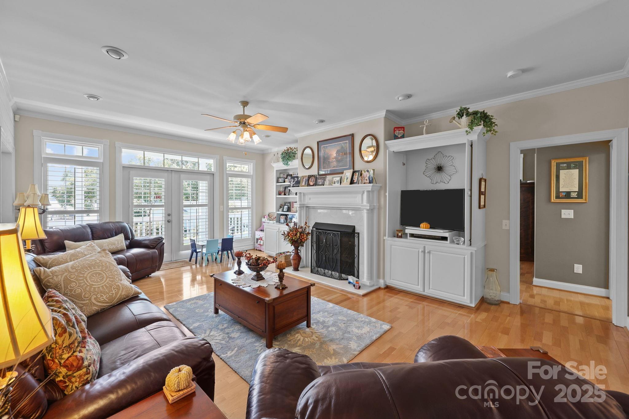 17200 Randalls Ferry Road Norwood, NC 28128 - Photo 18 of 48 a living room with furniture flat screen tv and a fireplace