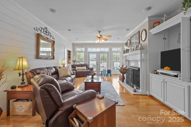 a living room with furniture rug and a large window