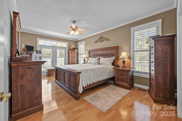 a bathroom with a granite countertop sink a large mirror and a bathtub
