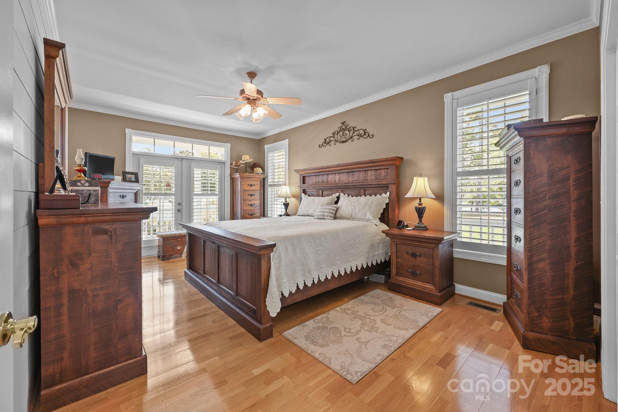 17200 Randalls Ferry Road Norwood, NC 28128 - Photo 21 of 48 a bedroom with a bed and a dresser with mirror