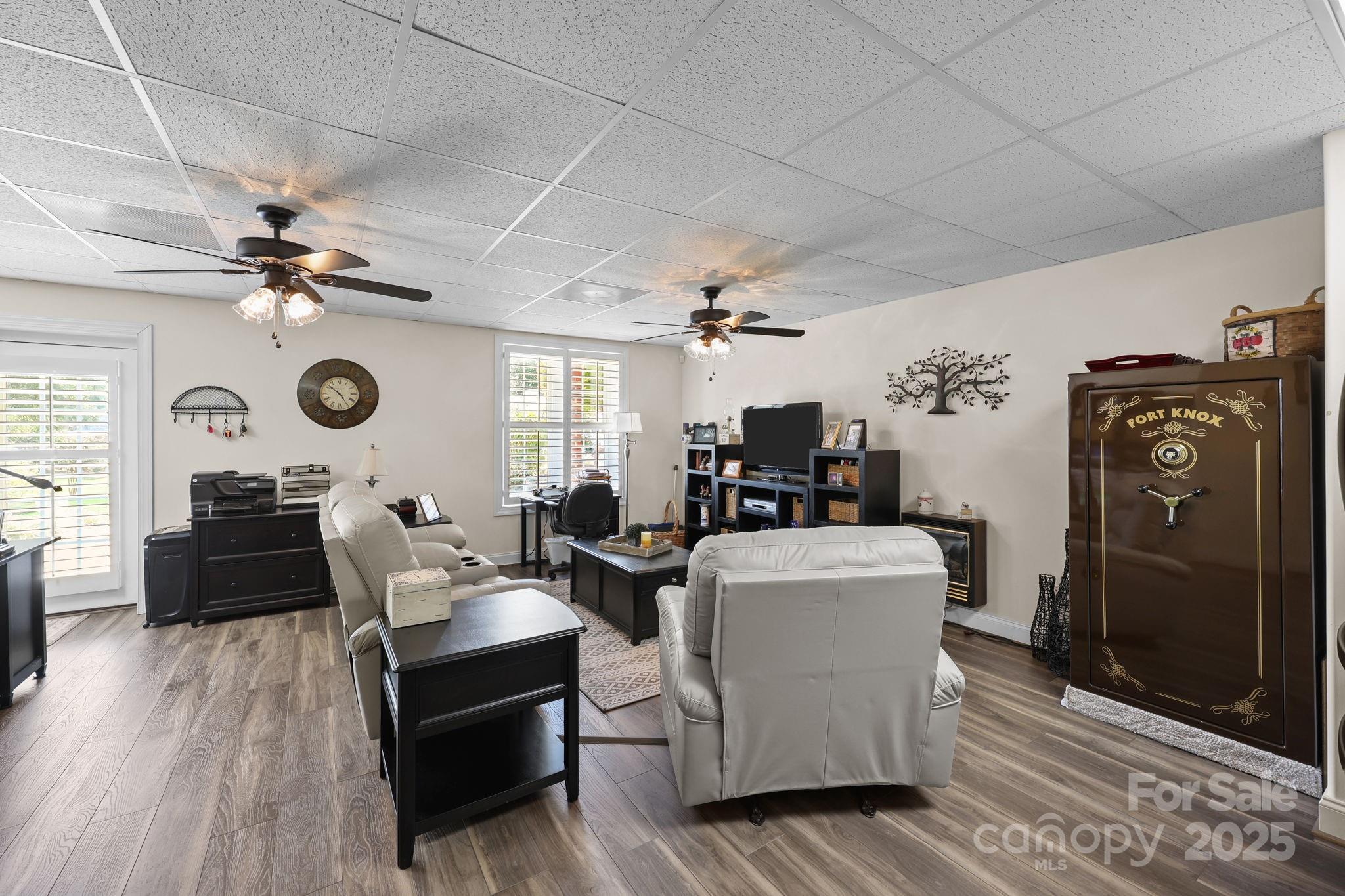 17200 Randalls Ferry Road Norwood, NC 28128 - Photo 33 of 48 a living room with furniture and a wooden floor