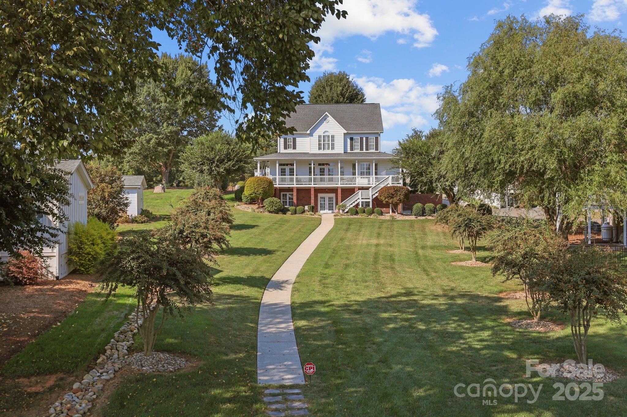 17200 Randalls Ferry Road Norwood, NC 28128 - Photo 38 of 48 a view of a house with a yard