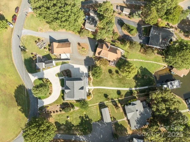 an aerial view of a house with swimming pool