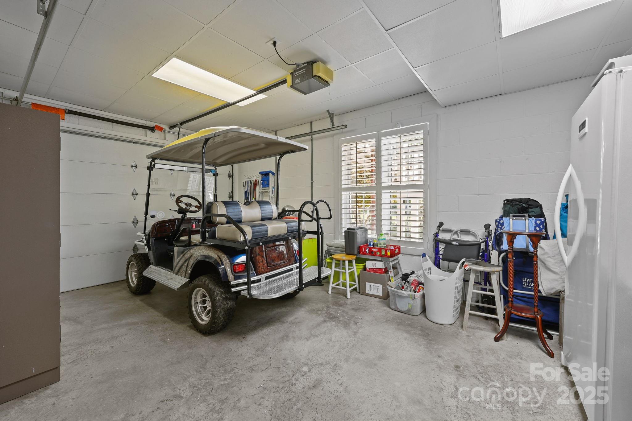 17200 Randalls Ferry Road Norwood, NC 28128 - Photo 44 of 48 a car is parked in a garage