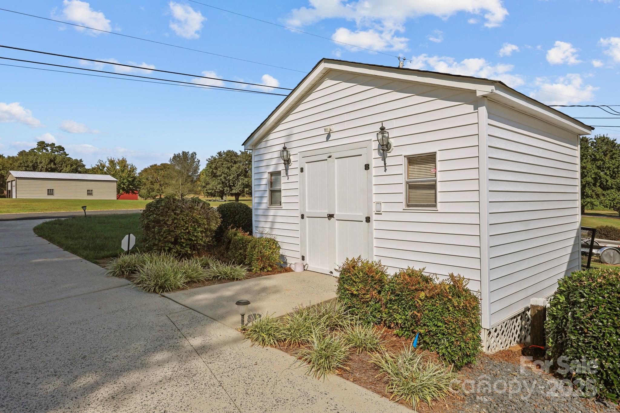 17200 Randalls Ferry Road Norwood, NC 28128 - Photo 46 of 48 a view of a house with a yard