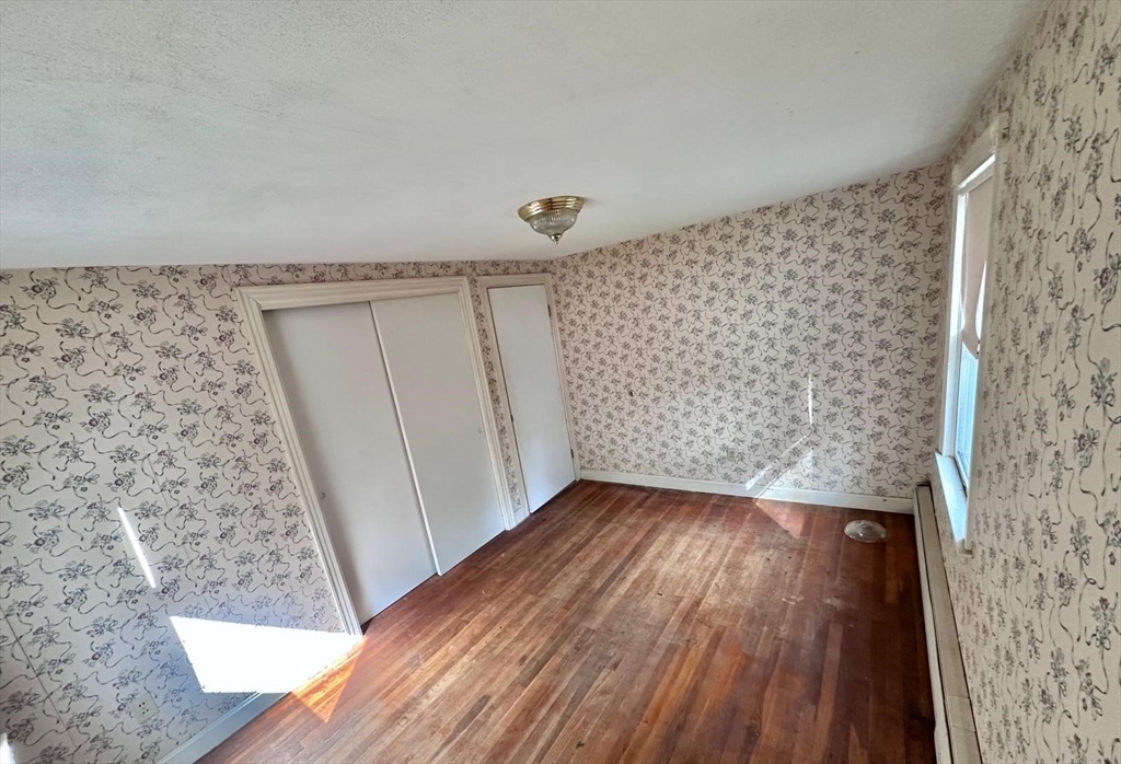 7 Lakeshore Drive Georgetown, MA 01833 - Photo 6 of 10 a view of wooden floor in a room