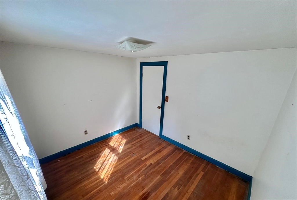 7 Lakeshore Drive Georgetown, MA 01833 - Photo 8 of 10 a view of empty room with wooden floor