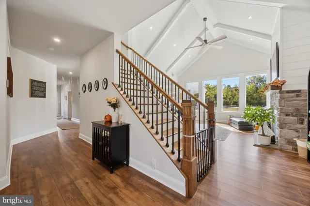 a bedroom with a bed dresser and a flat tv screen