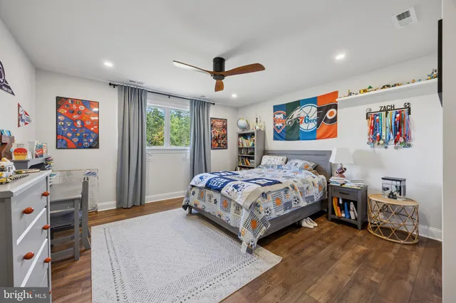 a bedroom with a bed and a dresser