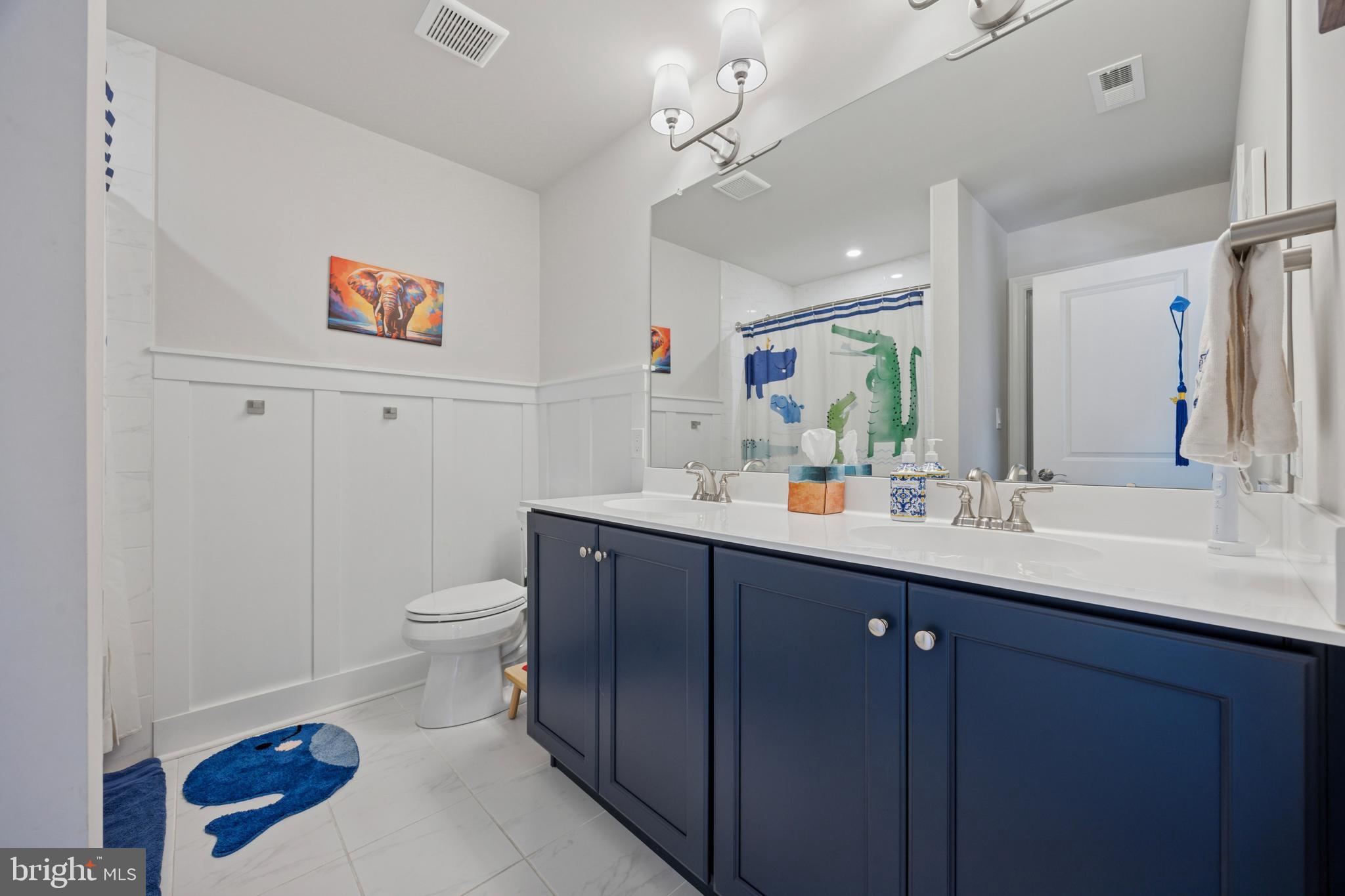 232 South Sugan Road New Hope, PA 18938 - Photo 22 of 31 a bathroom with a sink a toilet and a mirror