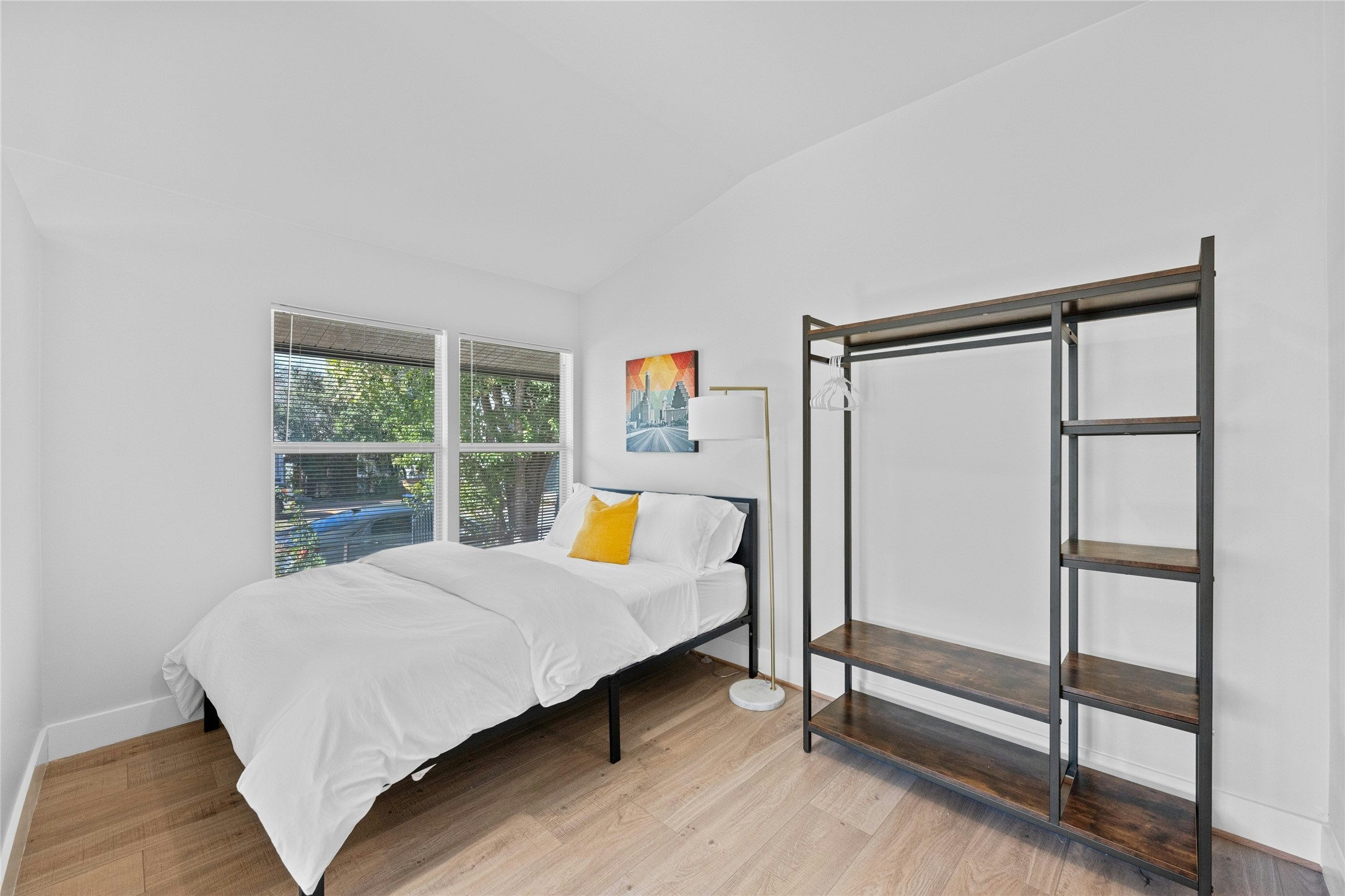 2201 Leon Street, Unit D Austin, TX 78705 - Photo 14 of 24 Bedroom with hardwood / wood-style floors and lofted ceiling