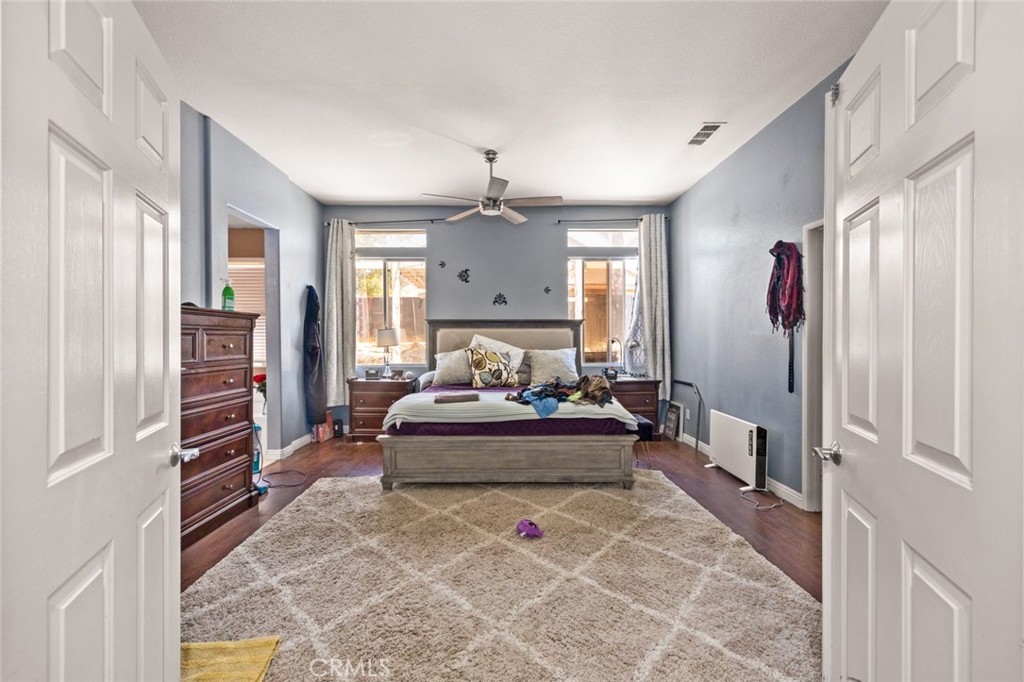 410 Windfields Way Beaumont, CA 92223 - Photo 14 of 41 a living room with furniture and a chandelier
