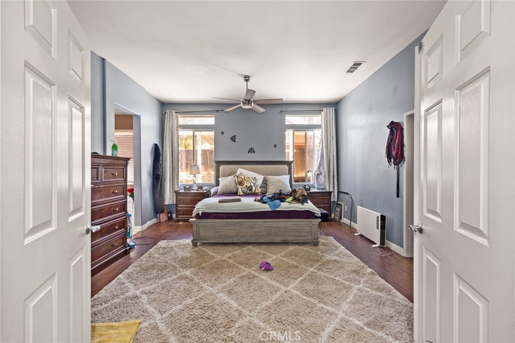 410 Windfields Way Beaumont, CA 92223 - Photo 14 of 41 a living room with furniture and a chandelier